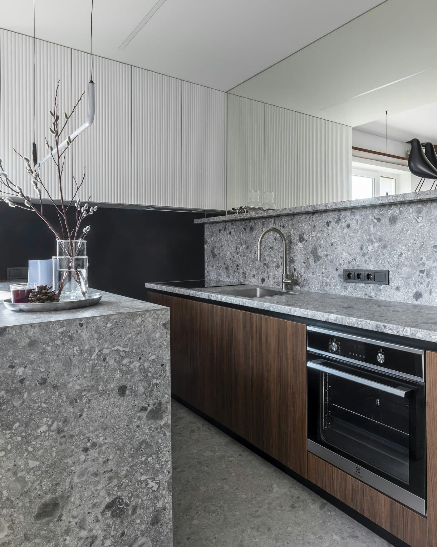The kitchen counter with morning light along its length.