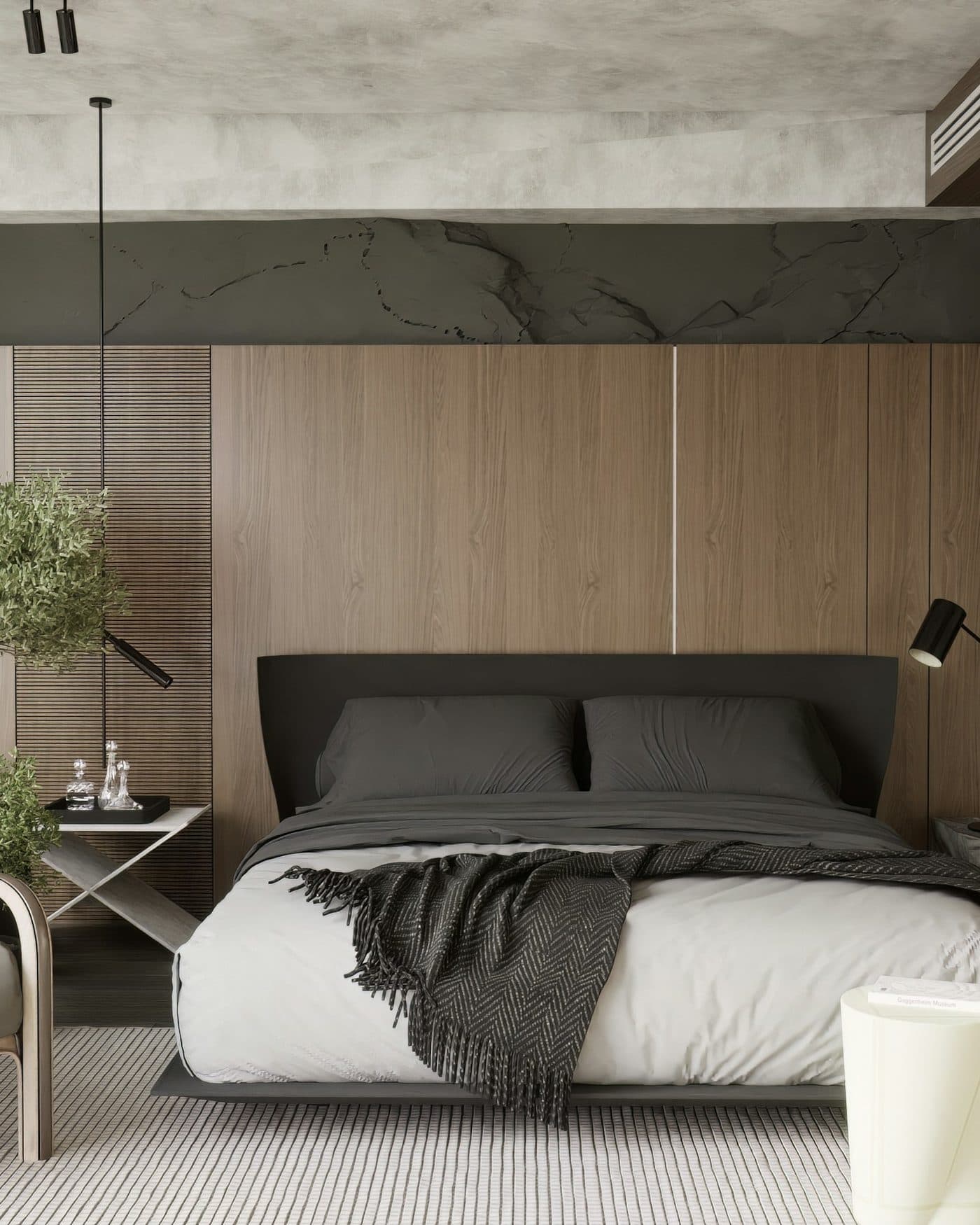 The master bedroom at early light, king bed against a wall of oiled teak storage.